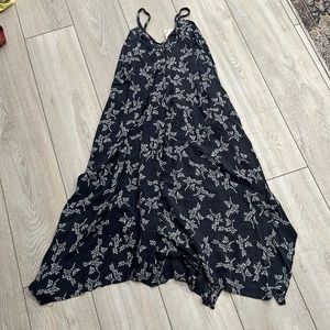 Dark blue dress. Split hem on bottom both sides. Has pockets.